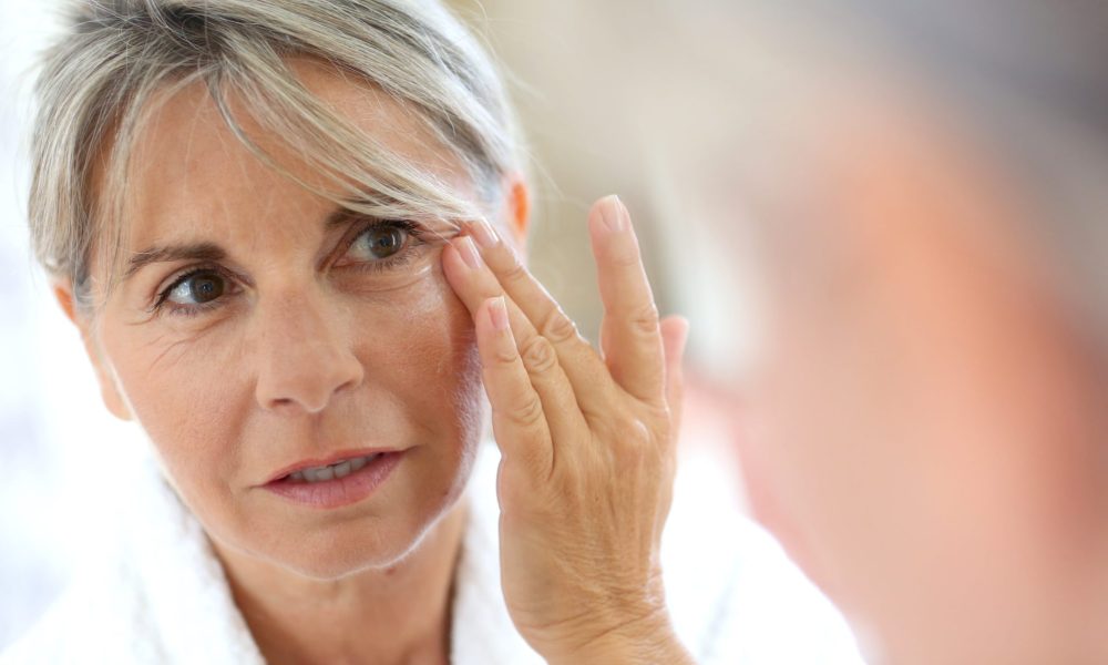 Old Woman Checking Wrinkles on her Face | Cloud 9 MedSpa in Casa Grande, AZ