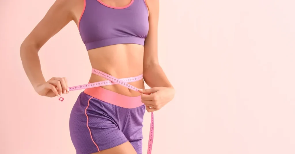 Women measuring waist after Medical weight loss program in Casa Grande, AZ